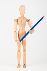 Small wood mannequin standing with colour pencil isolated on whi
