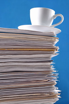Cup on a pile of papers