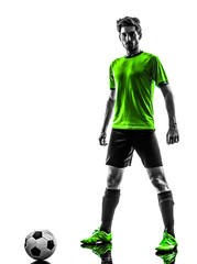 Obraz na płótnie Canvas soccer football player young man standing defiance silhouette