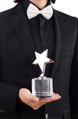 Businessman with star award isolated on white