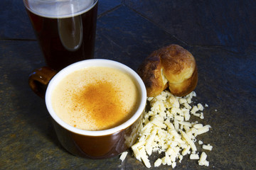 Beer Cheese Soup with Crumbled Cheese and Popover