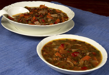 Beluga Lentil Soup in White Bowl and Tureen