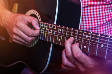 Fototapeta na wymiar Male Musician with a acoustic Guitar