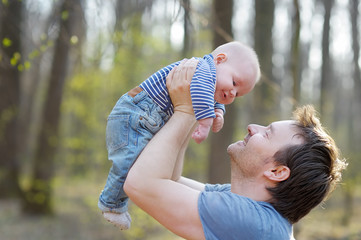 Man holding his little baby