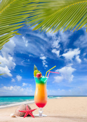 Fresh tropical cocktail on sunny beach in Maldives