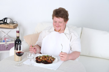 Tasty lunch for fat man, on home interior background
