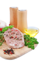 Raw meat steak with herbs and spices