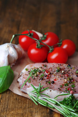 Raw meat steak with spices  herbs, on wooden background