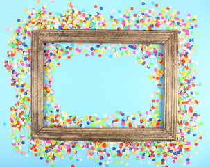 Photoframe with confetti on blue background
