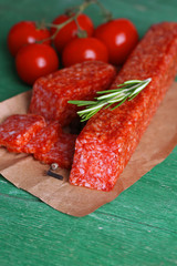 Tasty salami sausage, vegetables and spices