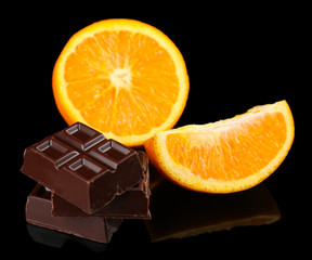 Chocolate and orange on black background