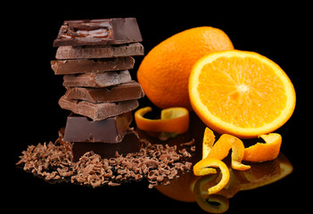 Chocolate and orange on black background