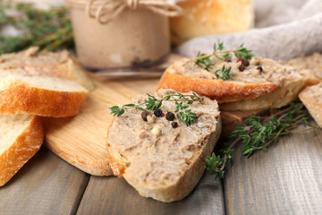 Fresh pate with bread on wooden table