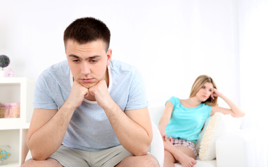 Portrait of young man and woman  conflict sitting