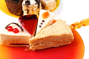 Assortment of pieces of cake, close up © Africa Studio