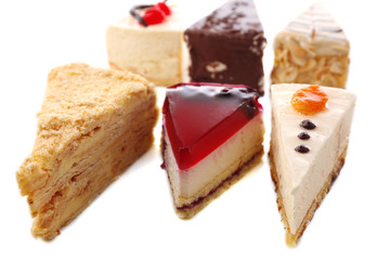 Assortment of pieces of cake, isolated on white © Africa Studio