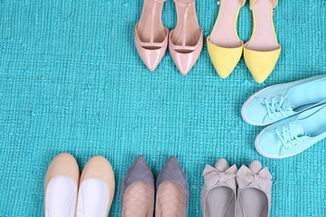 Female fashion shoes on blue carpet