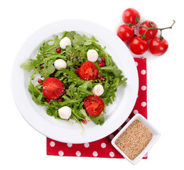Green salad made with  arugula, tomatoes, cheese mozzarella