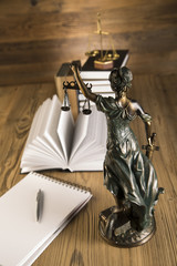 Lady of justice, Wooden & gold gavel and books on table
