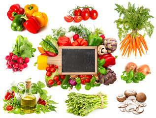 fresh herbs and vegetables with blackboard