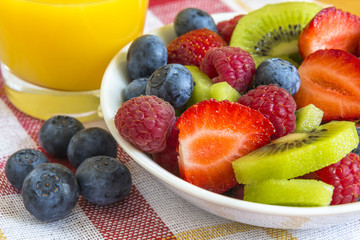 ripe berry and kiwi with orange juice