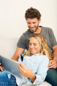 Young couple using tablet computer