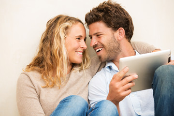 Young couple using tablet computer