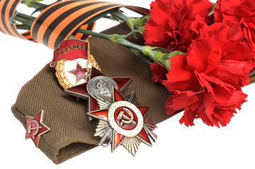 Military cap, red flowers, Saint George ribbon, orders of Great
