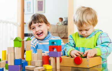 Two happy children playing in home