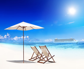 Deck Chairs on Beach with View of Cruise Ship