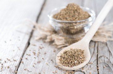Dried Aniseed on a wooden spoon