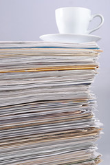 Cup on a pile of papers