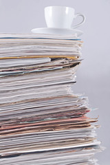 Cup on a pile of papers