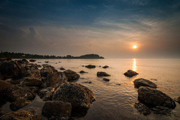 rock and sea on sunrise at hin ngam beach