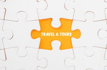 Fototapeta premium Missing piece of jigsaw puzzle revealing the TRAVEL & TOURS word