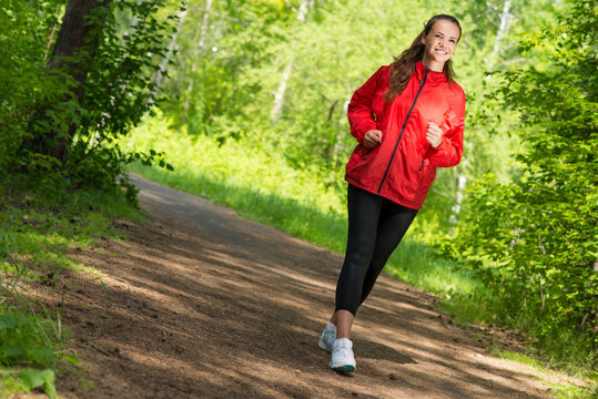 healthy young female athlete running