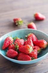 close up of strawberry on wooden background