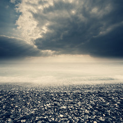 gravel and beach with sunset