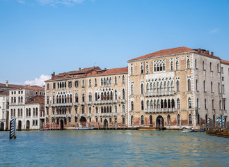 Fototapeta na wymiar Old Building on Blue Canal in Venice