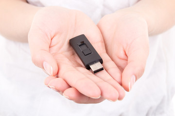young woman hands holding flash drive