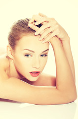 Fototapeta premium Beautiful naked topless caucasian woman lying down.