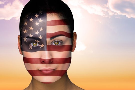 Composite image of beautiful brunette in america facepaint