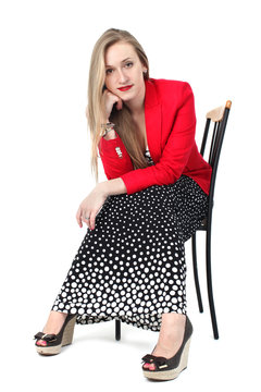Yong woman in classic Retro Polka Dot Dress and red coat isolate