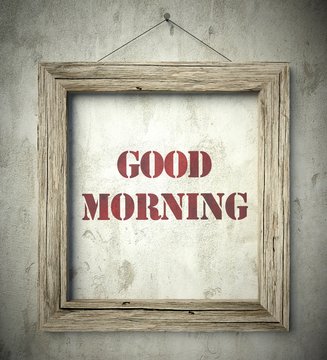 Good morning emblem in old wooden frame on wall