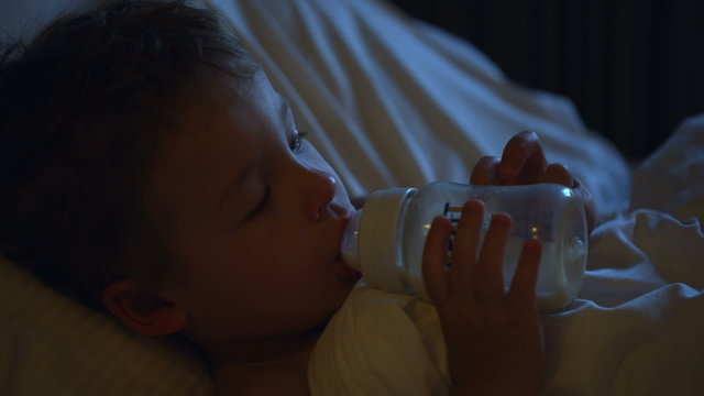 Boy drinking milk before bedtime