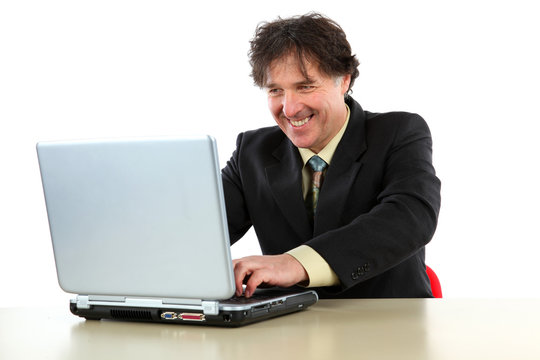Business man sitting in front of his computer and working