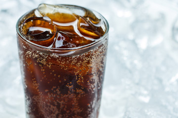 Cold cola soda drink with ice cubes