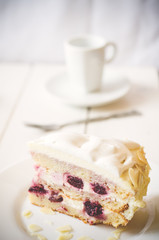 biscuit cake with cream and a cherry