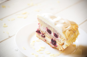 biscuit cake with cream and a cherry