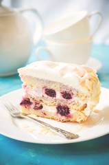 biscuit cake with cream and a cherry